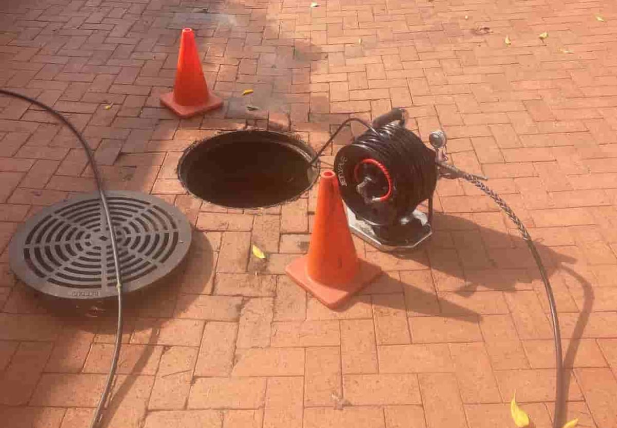 Tap Tech hydro jetter reel set up beside an open drain access point in Perth